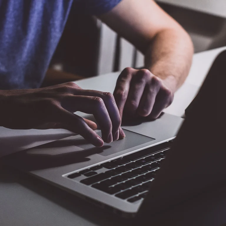 Person typing on a laptop