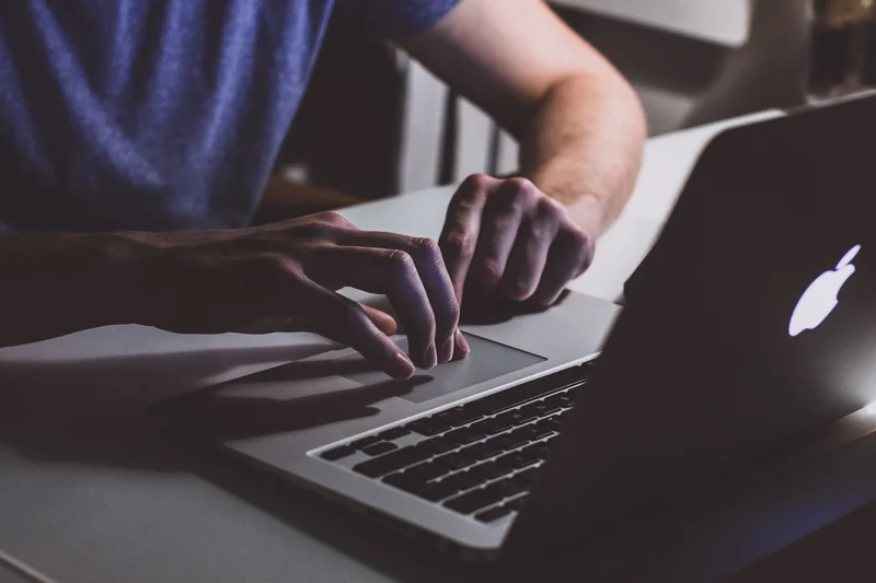 Person typing on a laptop