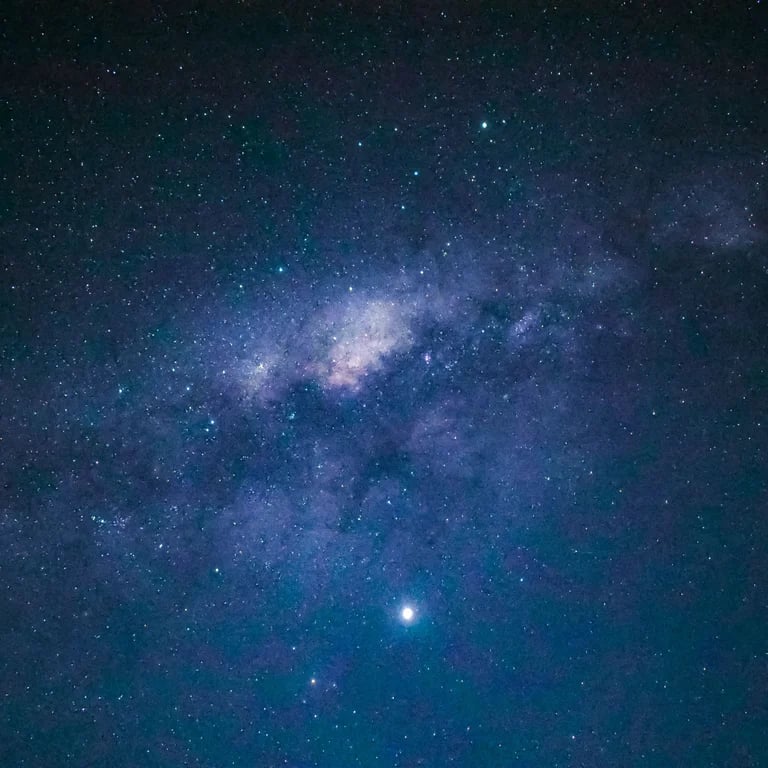 The Milky Way galaxy stretching across the dark night sky.
